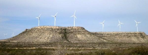 Wind turbines in West Texas help produce record amounts of electricity for the state.