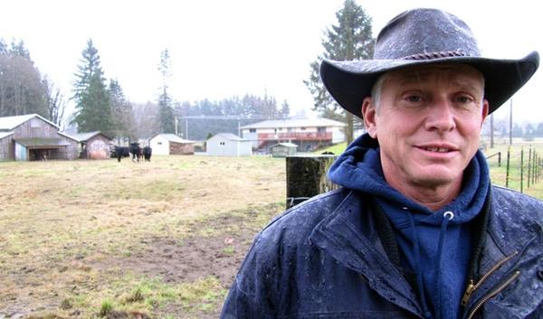 Richard Fox and his wife, Marnie, want to build a house and garage on their property near the Skagit River. The state says they can't have access to the water necessary to approve their building permit. 