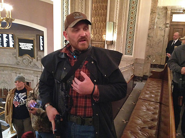 Jason McMillon was threatened with removal and arrest from the Washington House gallery for the ''tactical'' manner he was carrying his military-style pistol. 