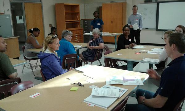 Parents and community members at Harding discuss CMS proposals for magnets.