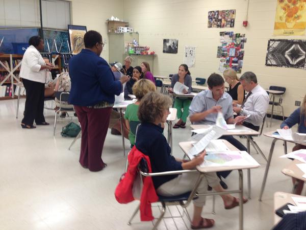 Parents at Myers Park break into groups and discuss transportation zones and new magnet optoins.