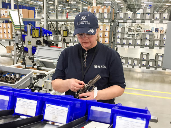 A worker assembles a handgun at the new Beretta plant in Gallatin, Tenn. The Italian gun maker has cited Tennessee's support for gun rights in moving its production from its plant in Maryland.