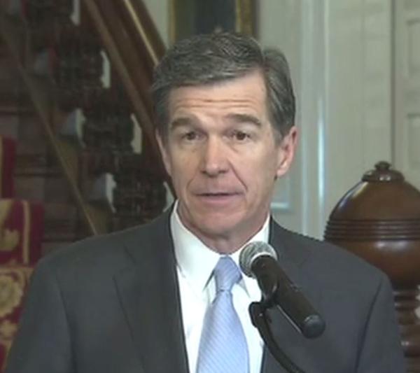 Gov. Roy Cooper announces that he signed HB 2 repeal bill Thursday. 