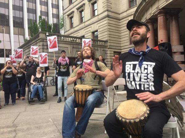 <p>A counter protest group chants, "Take your hate, and go away" outside City Hall in downtown Portland. Several counter protest groups showed up Sunday to opposed the Trump Free Speech Rally in Terry Schrunk Plaza.</p>