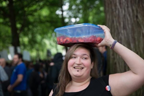 <p>Carson Hardly handed out free Oregon strawberries to counter protesters Sunday. "Life is better with strawberries in it," she said. "They're Oregon strawberries," she said.</p>