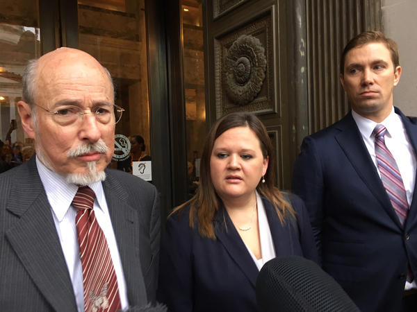 Former prison inmate turned honors law school graduate Tarra Simmons and her attorneys speak with reporters following a Washington Supreme Court hearing. 