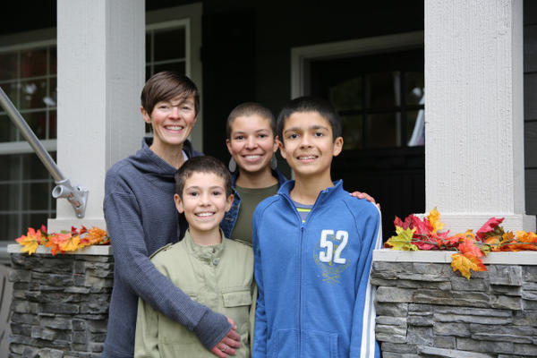<p>Angie Chapin with her children, Asjia, Imani and Kaliq (left to right) in front of their Camas, Washington home. Mekhi is not pictured here.</p>