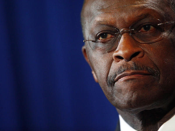 Herman Cain speaks at a press conference Tuesday in Scottsdale, Ariz., to rebut charges of sexual harassment. 