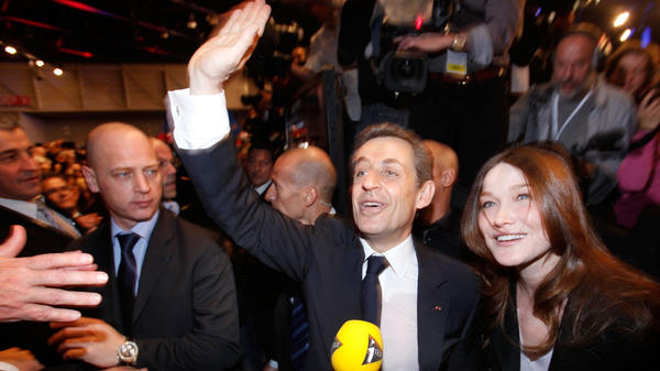 French President Nicolas Sarkozy and his wife, Carla Bruni Sarkozy, greet supporters during a campaign rally in Marseille, France, on Feb. 19.