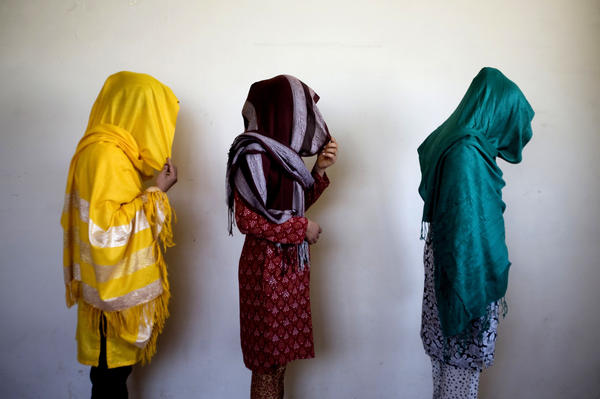Arazo, 19 (from right), Tabasum, 20, and Shamayal, 25, who fled from abusive family members, stand for a picture in Kabul, 2009.