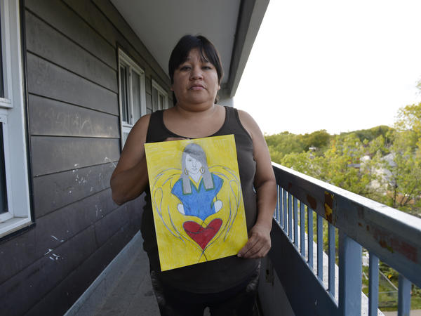 Lita Blacksmith displays a drawing she made of her 18-year-old daughter Lorna, who was murdered in Winnipeg in 2012. A police study found that 1 in 4 female homicide victims in Canada in 2012 was an aboriginal woman.