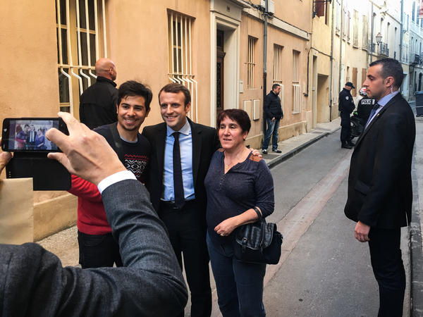 Emmanuel Macron has a photo taken with fans in the southern town of Carpentras, where he campaigned earlier this month. Macron has bucked the two-party system to run as an independent.