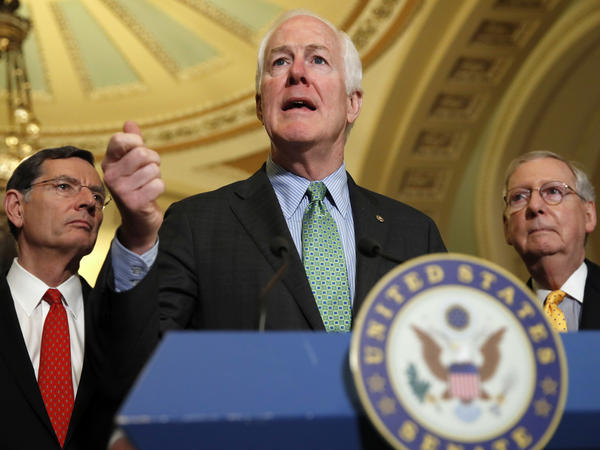 Senate Majority Whip John Cornyn of Texas, center, flanked by Sen. John Barrasso, R-Wyo., left, and Senate Majority Leader Mitch McConnell of Ky., speak to the media Tuesday, on Capitol Hill.