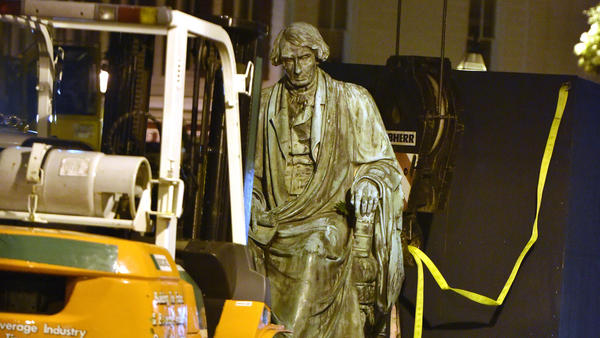 Crews worked to remove the statue of Supreme Court judge and segregationist Roger Taney from the front lawn of the Maryland State House late Thursday night. Taney wrote the 1857 <em>Dred Scott</em> decision that defended slavery and said black Americans could never be citizens.
