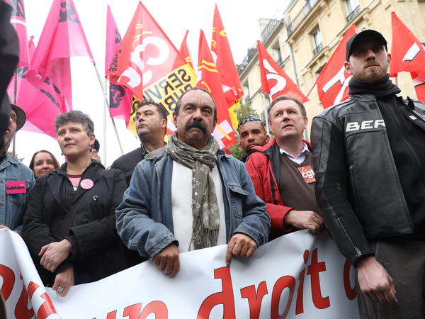 Demonstrators including French trade union leader Philippe Martinez, center, protest against President Emmanuel Macron's fast-tracked labor law reforms on Sept. 12 in Paris.