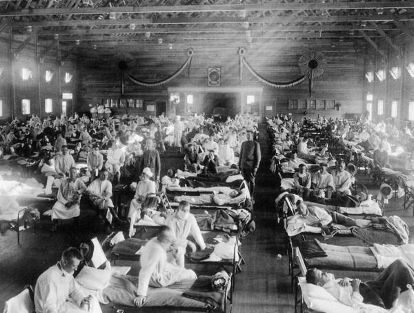 Patients are treated at an Army ward in Kansas during the influenza epidemic of 1918. About 675,000 Americans died of the flu known as "la grippe."