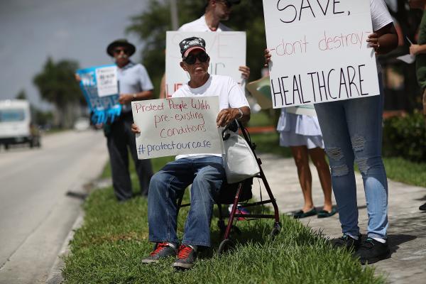 Shelton Allwood joined other demonstrators in Miami last year calling for continued protection for people who have pre-existing medical conditions.