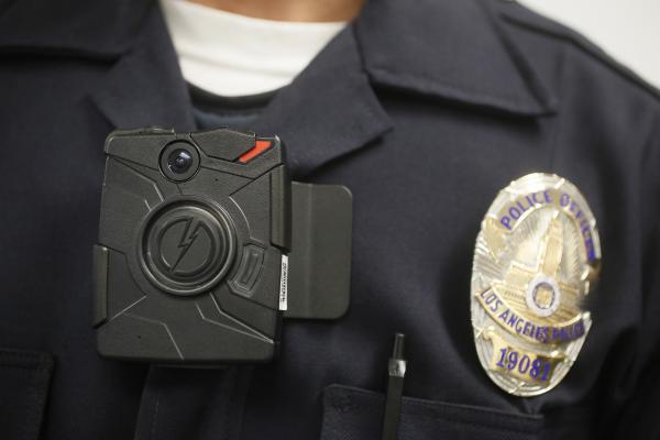 A Los Angeles Police officer wears an on-body camera during a demonstration in Los Angeles. 