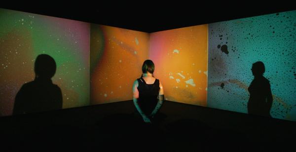 A woman looks at Metzger's <em>Liquid Crystal Environment</em>, part of a 2009 retrospective of his work at London's Serpentine Gallery.