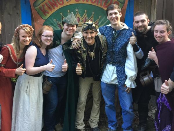 Johnny Fox, middle, gives a thumbs up with fans at the Maryland Renaissance Festival.