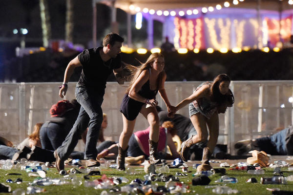 Concertgoers flee gunfire at the Route 91 Harvest country music festival in Las Vegas on Oct. 1.