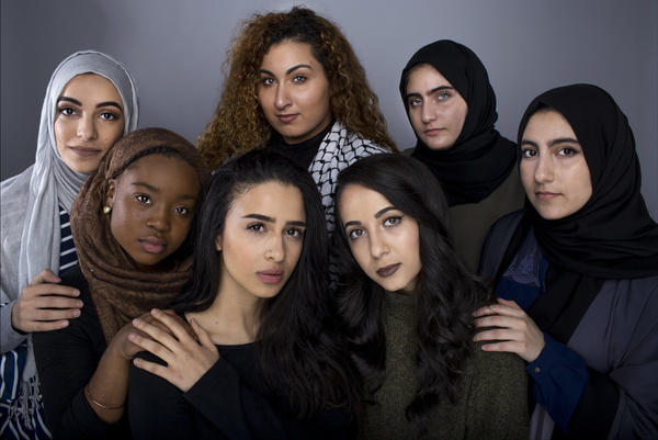 American Muslim college students in Ohio (front row: left to right) Halimah Muhammad (in brown hijab), Fatima Shendy, Zaina Salem, Ruba Abu-Amara, (back row: left to right) Arkann Al-Khalilee (in gray hijab), Nora Hmeidan and Lama Abu-Amara appear in an image that was featured in Uhuru, a Kent State University magazine in an issue on identity and race.