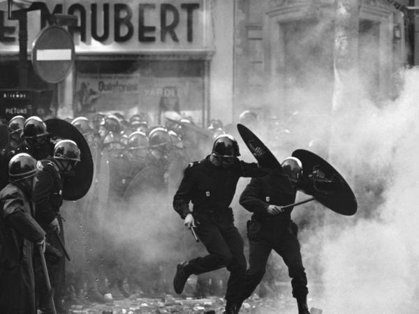Anti-riot police charge through the streets of Paris during violent student demonstrations on May 6, 1968.