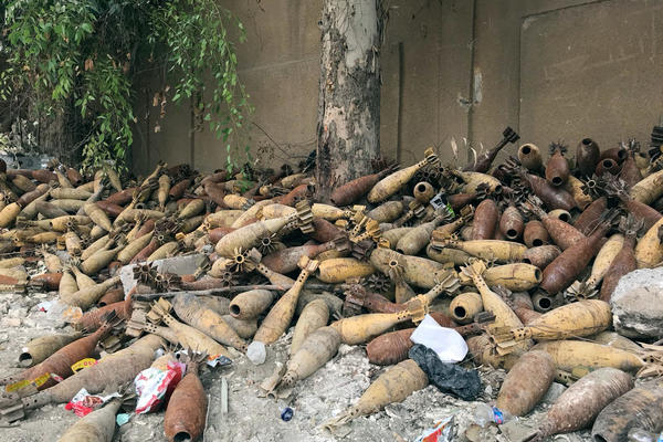 Mortar shells are piled up in the back of a school playground in Raqqa, Syria.