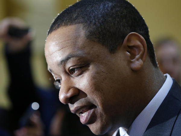 justin fairfax speaks to the media in the rotunda at the