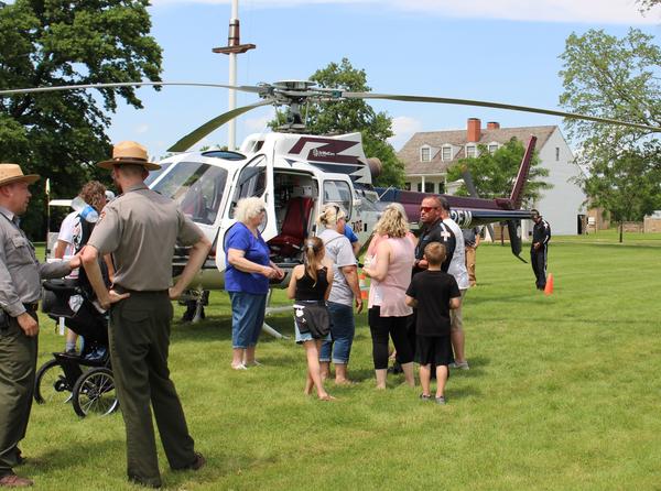 Visitors and park rangers at historic Fort Scott check out a medevac helicopter operated by Midwest AeroCare during the Kansas town's Good Ol' Days festival.