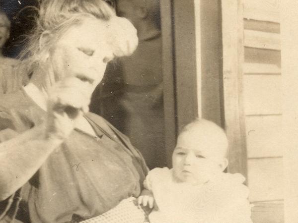 The only surviving photo of Vivian Buck, here with her adoptive mother in 1924. This is the moment Vivian is determined by a eugenics researcher to be "feeble-minded" for not looking at a coin held in front of her face.