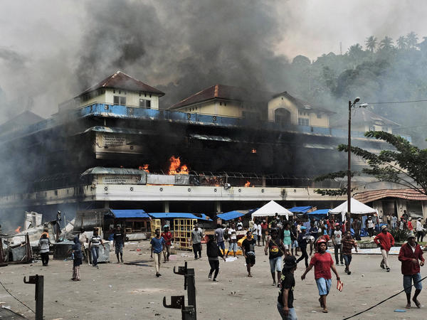 A local market is seen burning during a protest in Fakfak, West Papua, Indonesia, on Aug. 21. Violent protests this month were sparked by accusations that security forces had arrested Papuan students in East Java.