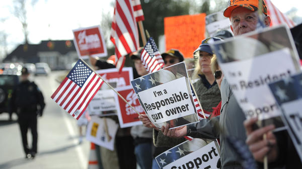 Supporters for gun rights gather outside the National Shooting Sports Foundation headquarters in Newtown, Conn., on March 28.