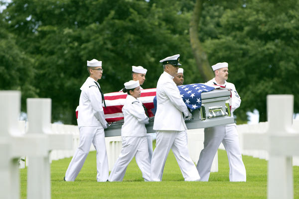 U.S. Navy personnel carry the casket of World War II sailor Julius "Henry" Pieper during a reburial service at the Normandy American Cemetery, Colleville-sur-Mer, France, on June 19. Seventy-four years to the day after their ship hit a mine off the coast of Normandy and sank, the soldier's remains were finally reunited with, and laid to rest beside, his twin brother Ludwig "Louie" Pieper.