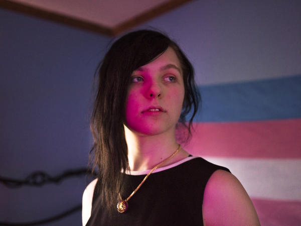 Quinn Robinson, 18, poses for a portrait in her bedroom in Allendale, Mich.