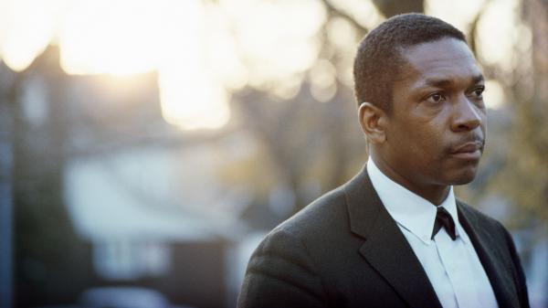 John Coltrane, photographed in his backyard in Queens, New York in 1963.