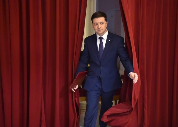 Volodymyr Zelenskiy enters a hall in Kyiv on March 6 to take part in the taping of the television series <em>Servant of the People. </em>His role on the show was as a fictional president of Ukraine.