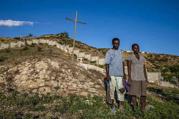 Duenet Alexand (left) and Berthenid Dasny have been maintaining the grounds at the St. Christophe memorial at Titanyen, north of Port-au-Prince, where thousands of earthquake victims were buried in mass graves.