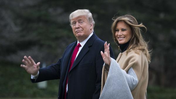 President Trump and first lady Melania Trump walk along the South Lawn as they depart from the White House for a weekend trip to Mar-a-Lago in Florida on Friday.