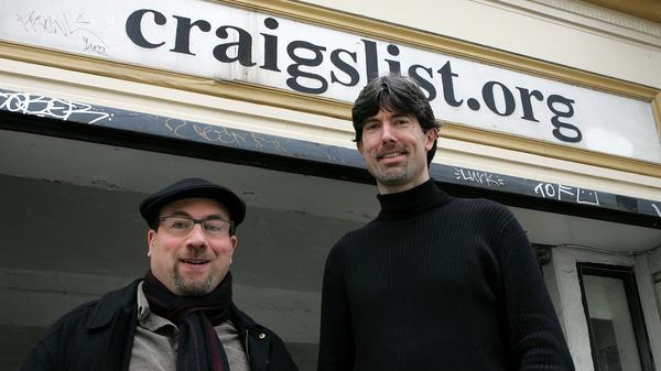 Craigslist founder Craig Newmark (L) and CEO Jim Buckmaster pose in front of the Craigslist office March 21, 2006 in San Francisco. The site has become a behemoth but changed little aesthetically.