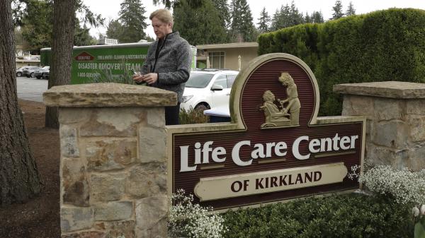Tim Killian, a spokesman for Life Care Center in Kirkland, Wash., prepares to give a daily briefing to reporters on Wednesday.