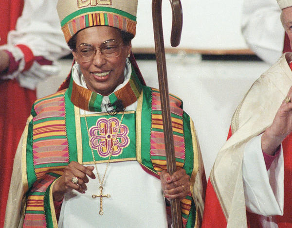 Bishop Barbara Harris smiles at the congregation after her ordination as the first woman bishop in the history of the Episcopal Church at the Hynes Convention Center in Boston on Feb. 11, 1989. Harris died Friday at age 89.