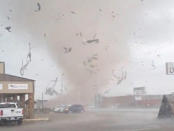 A screen grab from a social media video shows a tornado tearing through Jonesboro, Ark., on Saturday.