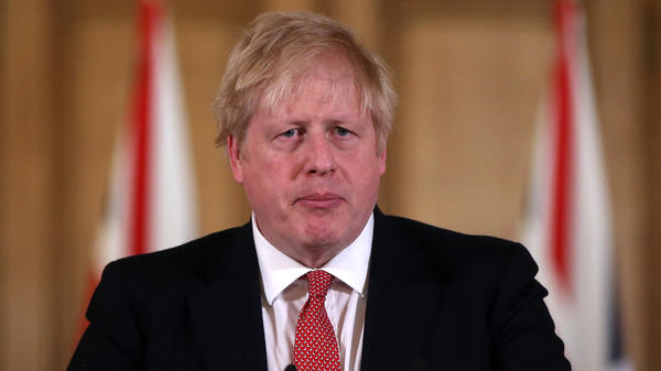 British Prime Minister Boris Johnson, seen on March 22, tested positive for the coronavirus 10 days ago. He's been admitted to a hospital for testing.