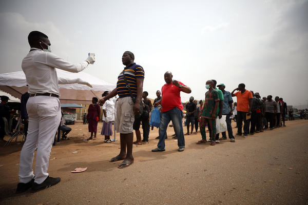 People get their temperatures taken at the border between Abuja and the Nasarawa State, Nigeria, on March 30. African countries are working to prepare for the rise in cases of COVID-19 as the coronavirus spreads on the continent.