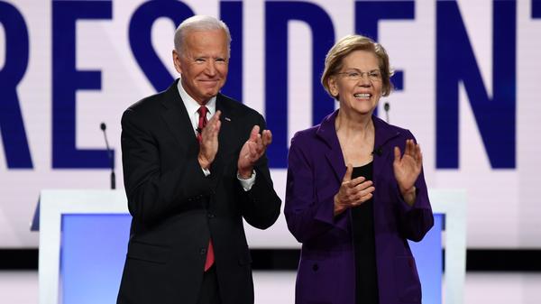 Former Vice President Joe Biden and Massachusetts Sen. Elizabeth Warren appear before a Democratic primary debate in Ohio last year.