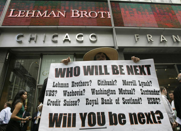 Robin Radaetz holds a sign in front of the Lehman Brothers headquarters in 2008 in New York. Lehman Brothers' Chapter 11 declaration was the biggest bankruptcy filing ever at the time.