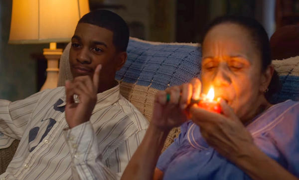 Brett Gray (left) as Jamal Turner, and Peggy Blow as Abuela, a lovable, pot-smoking grandma, in the first season of the Netflix teen drama <em>On My Block</em>.