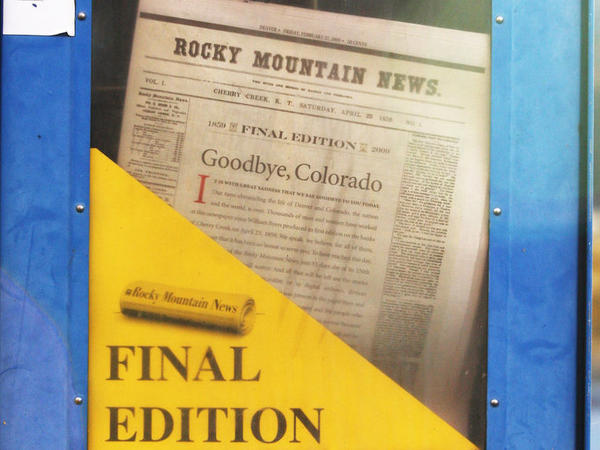 A copy of the final edition of the Rocky Mountain News sits in a newspaper box on a street corner in Denver, Colorado.