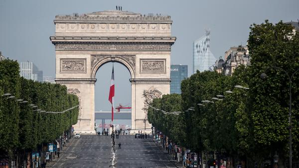 The iconic Champs-Élysées and its Arc de Triomphe stand eerily empty before V-E Day ceremonies Friday in Paris. The 75th anniversary of the end of World War II in Europe, which was expected to be a time for vast parades and celebration, instead unfolded in the shadow of France's coronavirus lockdown.